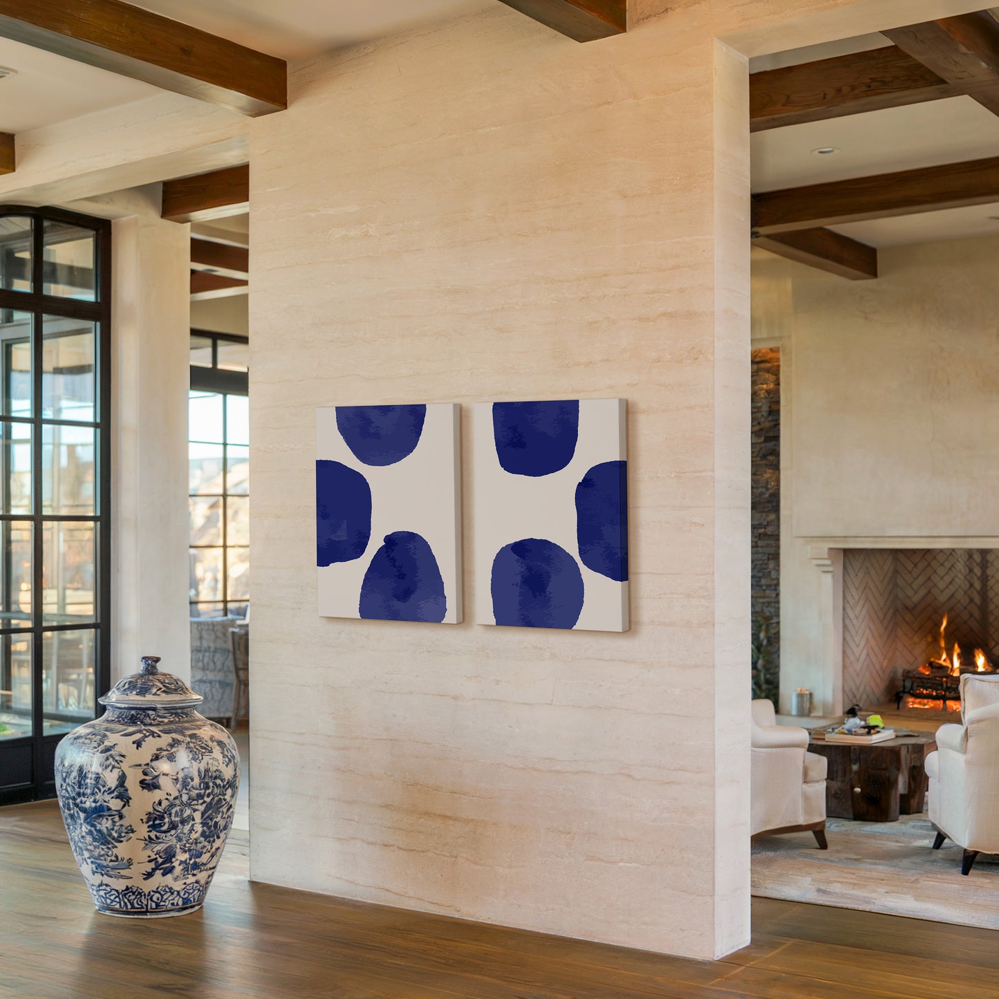 Two abstract art prints with blue shapes on a minimal background