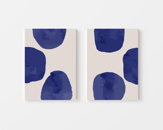 Two abstract art prints with blue shapes on a minimal background