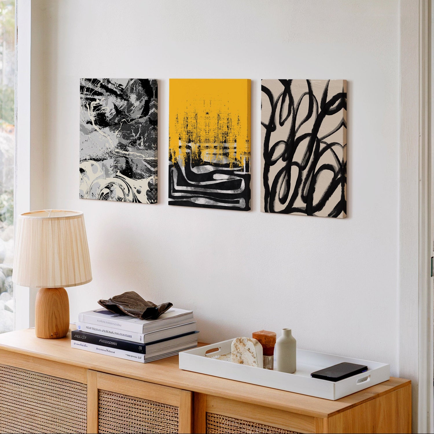 Modern abstract wall art set with black and yellow vibrant painting on a modern wall