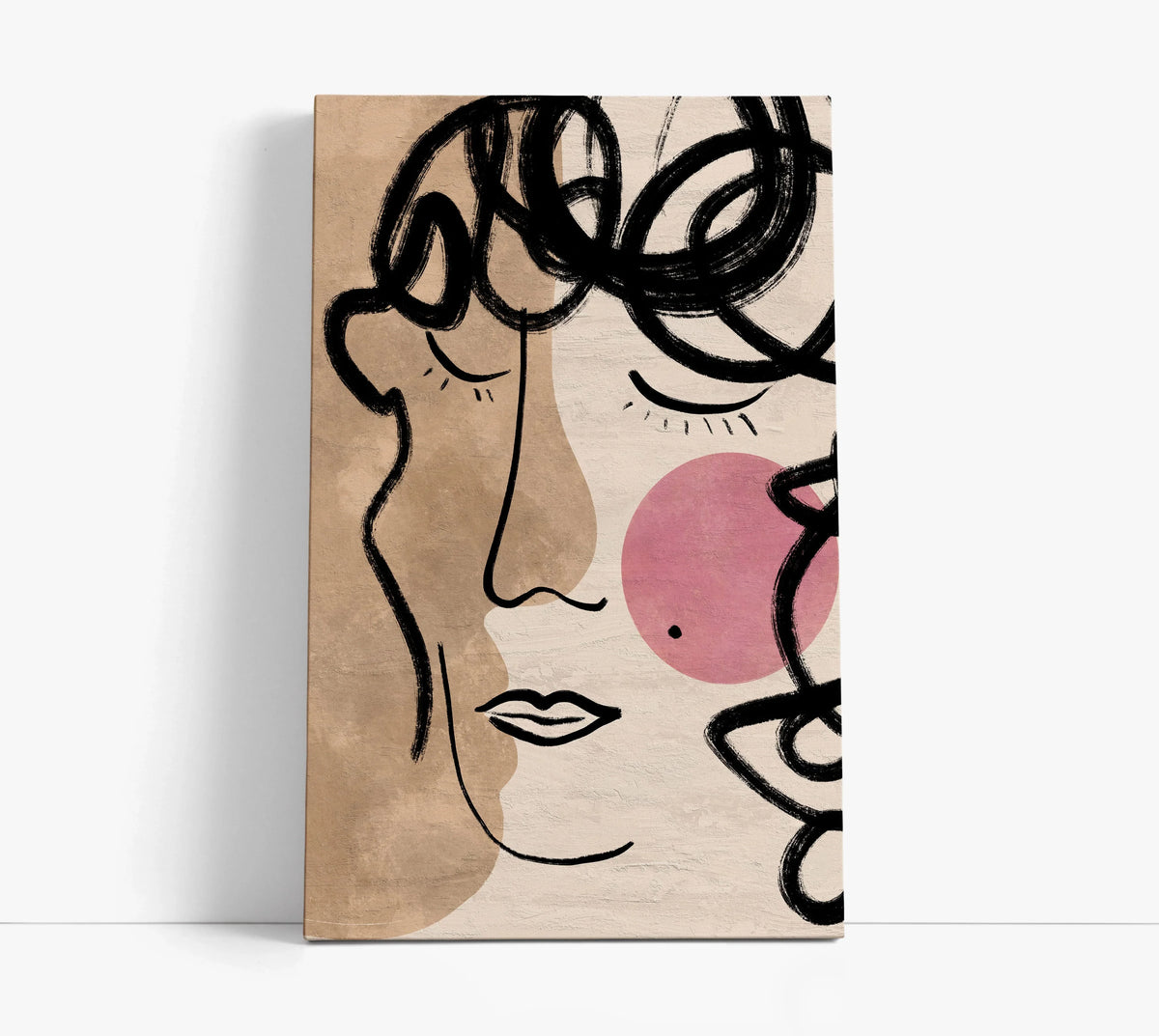 Abstract face canvas art with bold black lines, pink circle, and beige tones for modern home decor