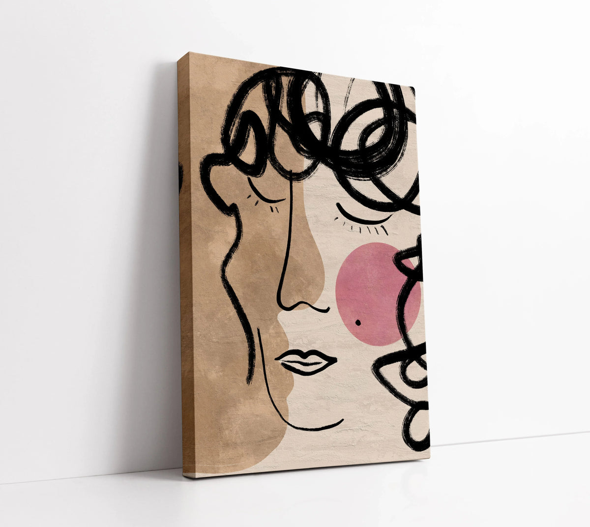 Abstract face canvas art with bold black lines, beige tones, and pink accents for modern home decor