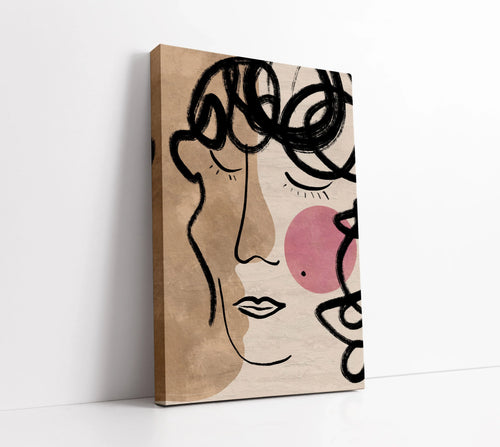Abstract face canvas art with bold black lines, beige tones, and pink accents for modern home decor