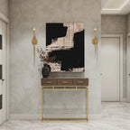 Black and beige abstract wall art print above modern console table in luxury hallway decor