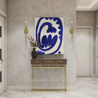 Blue abstract wall art print with modern decor, gold sconces, and console table in contemporary entryway